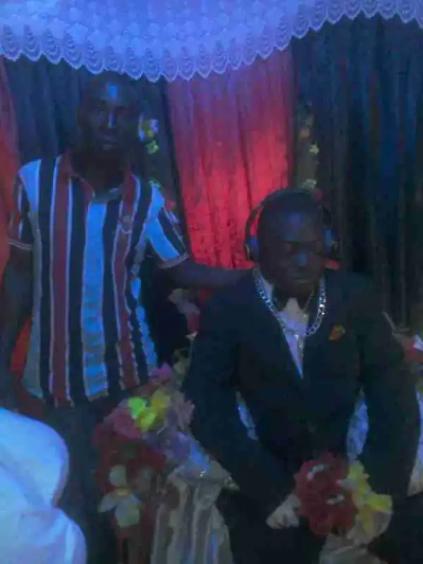 Dead Man Dressed In Suit With Silver Chain And Headset For His Burial (Photo)